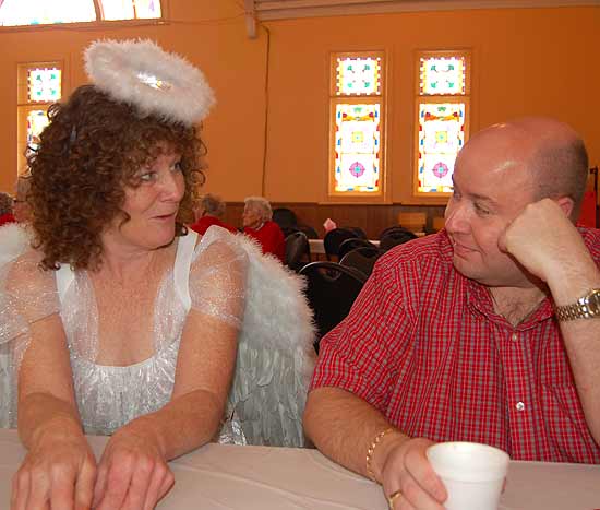 Dennis Harrington in conversation with Cupid, AK- Volunteer Carol Ann Flannery
